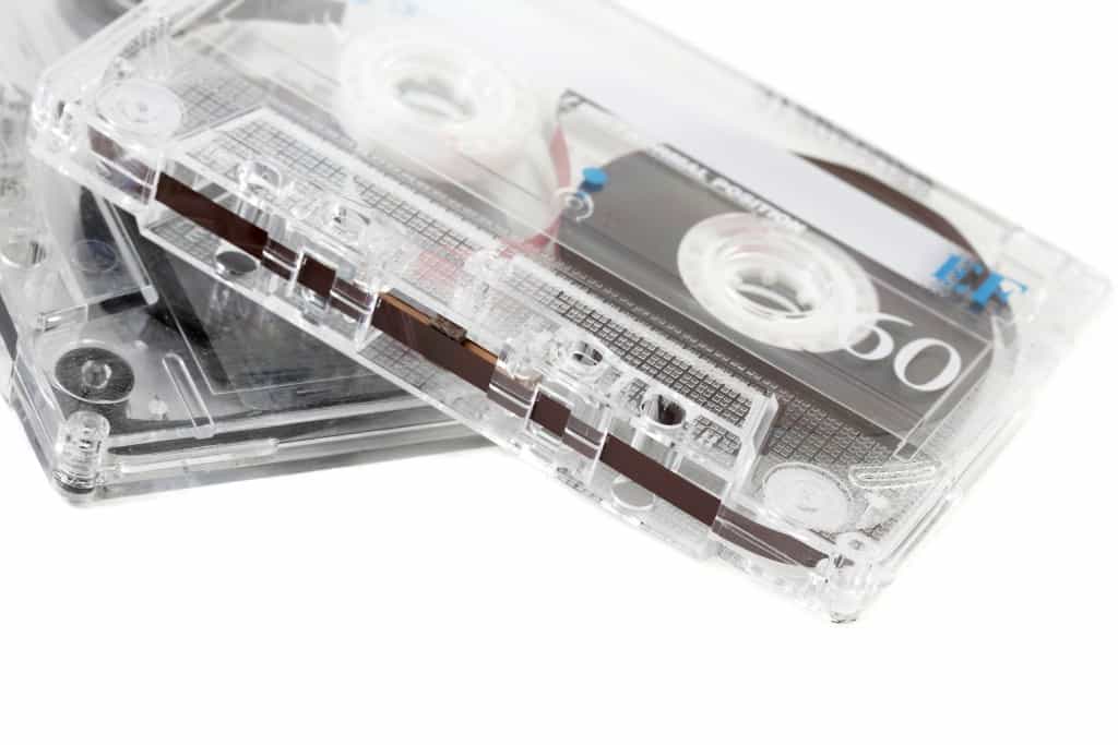 Old audio cassette on white background